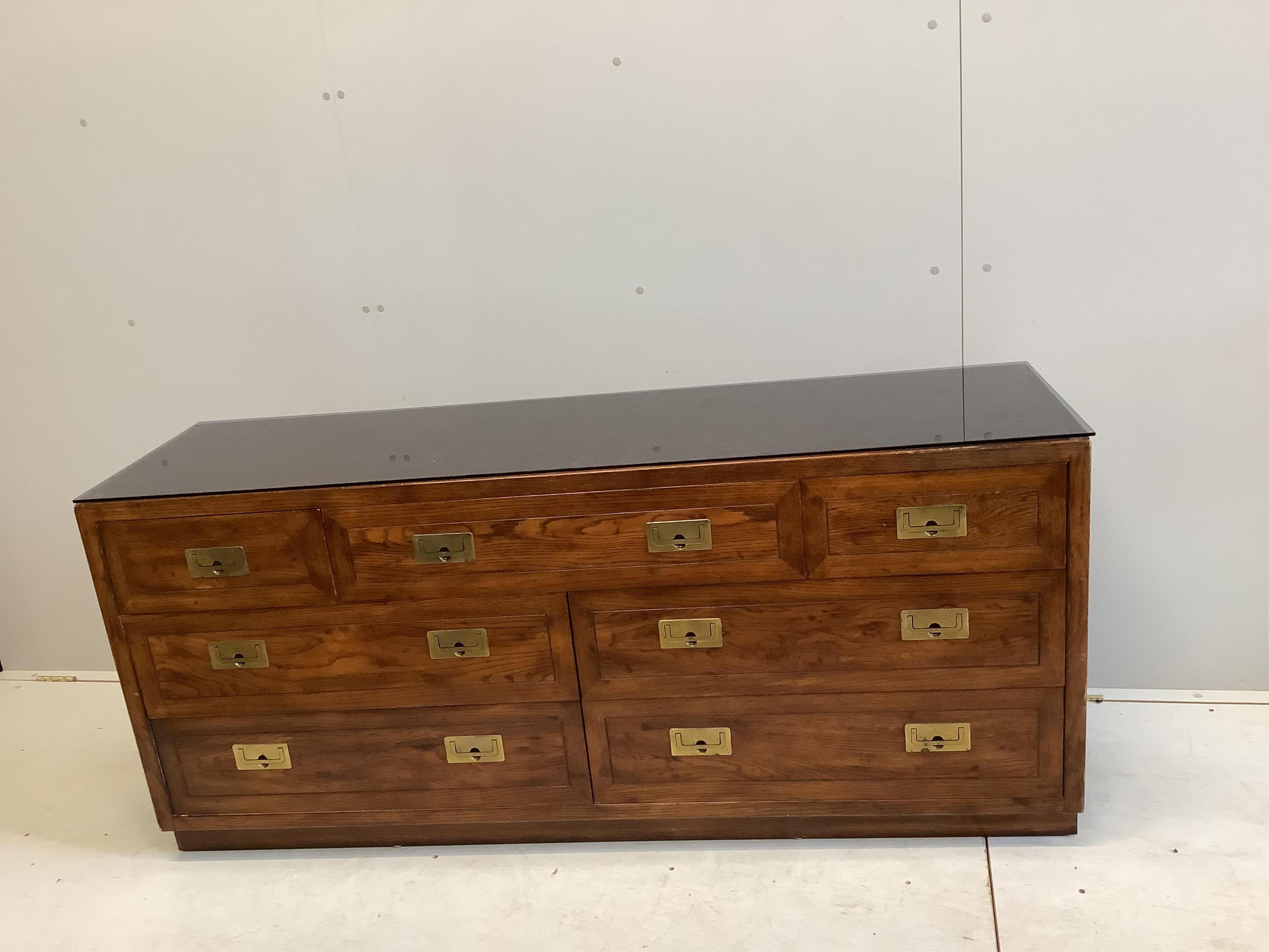 A Chinese style brass mounted elm low sideboard, width 162cm, depth 46cm, height 72cm. Condition - fair to good